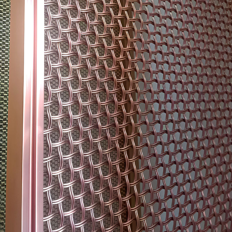 Arquimesh QKCWM decorative metal mesh panel used as a stylish interior partition in modern architectural design