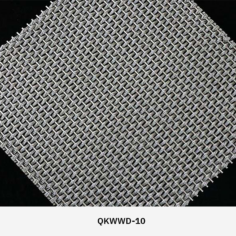 Woven wire drapery curtain panel made of decorative metal mesh used as a modern room divider or wall covering in architectural design.