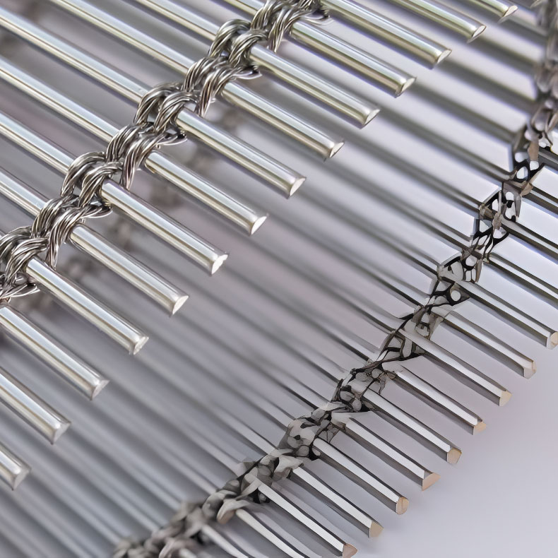 Woven wire drapery curtain panel made of decorative metal mesh used as a modern room divider or wall covering in architectural design.