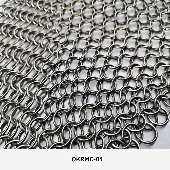 Decorion QKRMC decorative stainless steel ring mesh curtain used as a modern room divider in a commercial interior setting.