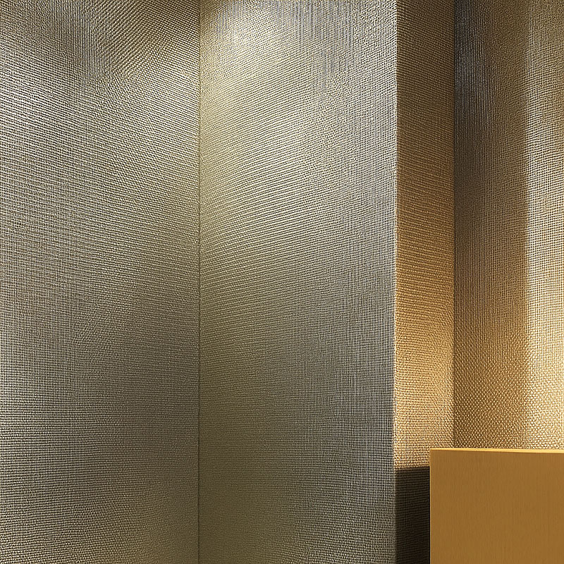 FibraMetis architectural mesh drapery showcased as interior wall cladding, highlighting custom woven metal fabric in a sophisticated interior setting.