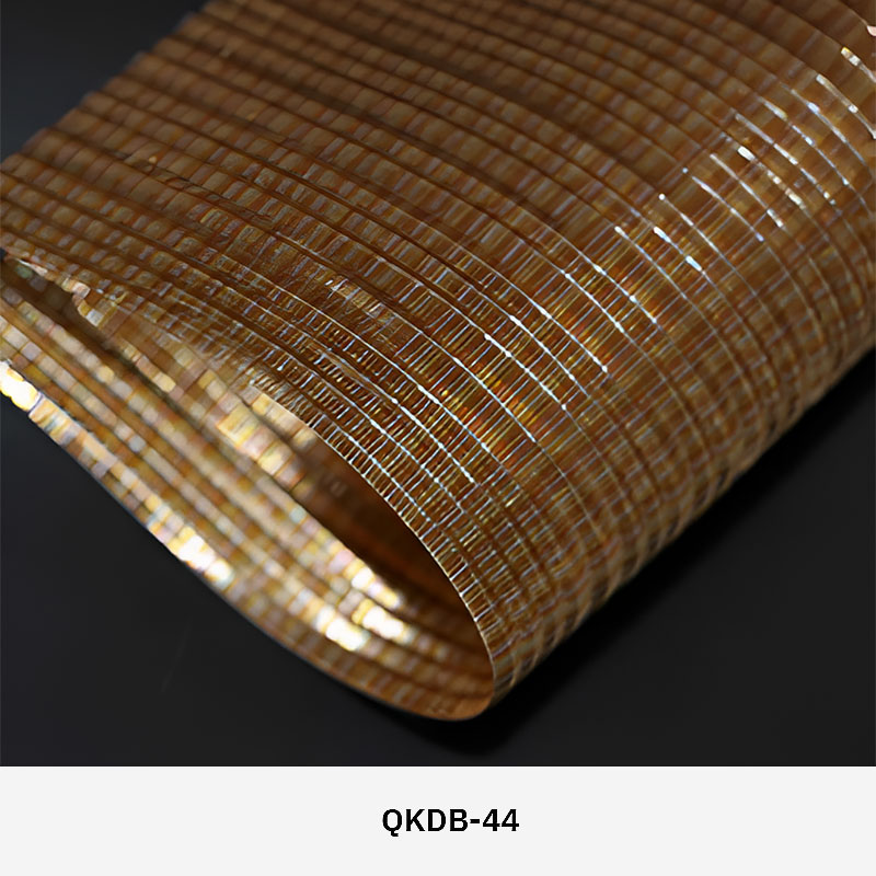 FibraMetis QKDB interior metal drapery used as a decorative wall panel, featuring woven wire fabric in custom colors and patterns