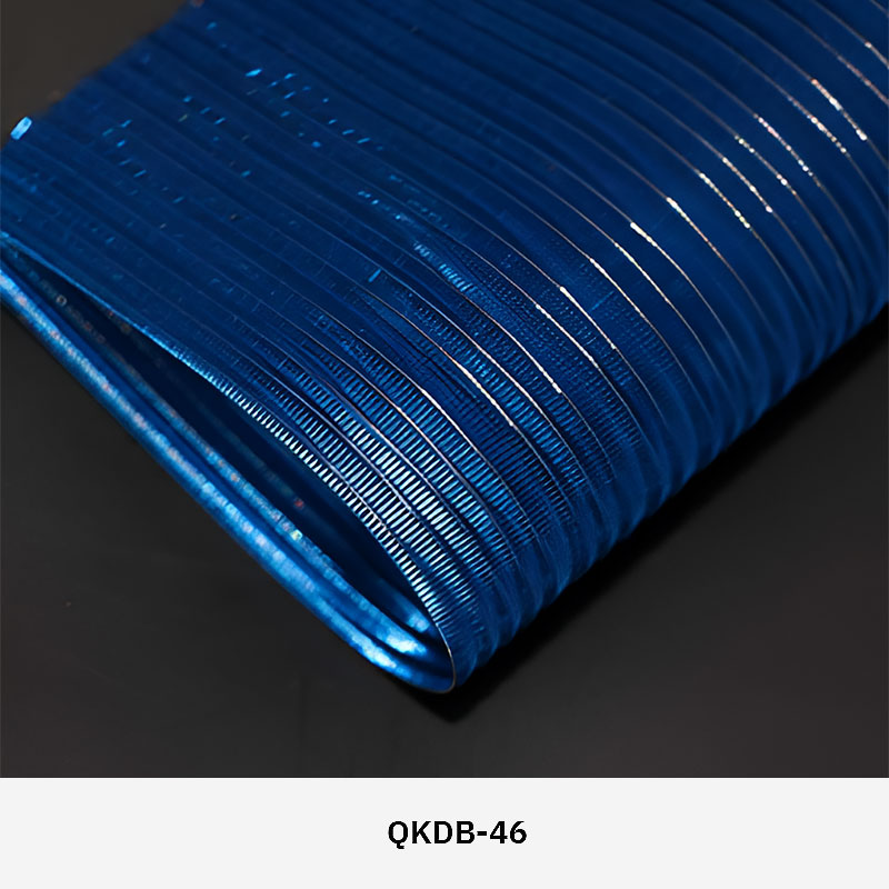 FibraMetis QKDB interior metal drapery used as a decorative wall panel, featuring woven wire fabric in custom colors and patterns