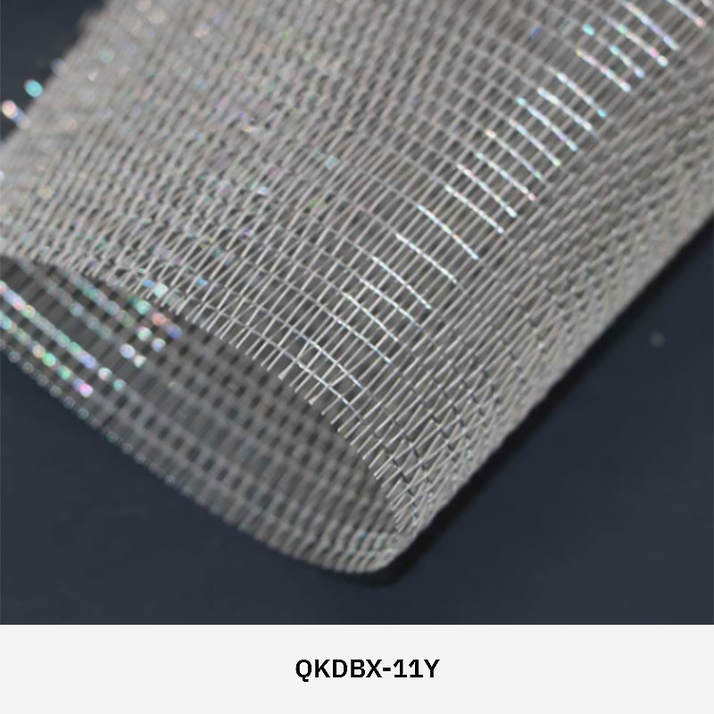 FibraMetis QKDBX decorative wire drapery installed as a modern wall panel, featuring custom woven metal mesh in silver finish