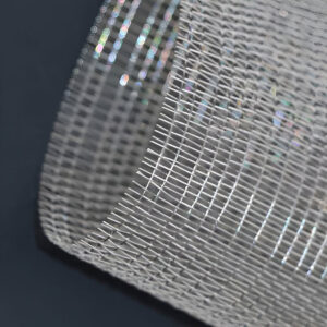 FibraMetis QKDBX decorative wire drapery installed as a modern wall panel, featuring custom woven metal mesh in silver finish