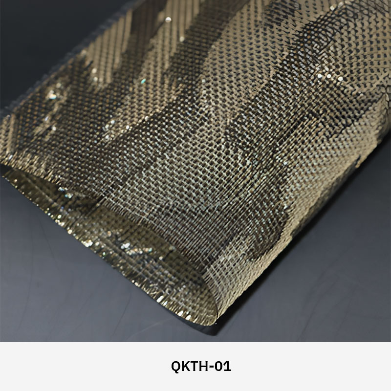 FibraMetis QKTH architectural mesh drapery used as interior wall cladding, featuring custom woven metal fabric with elegant metallic finishes.