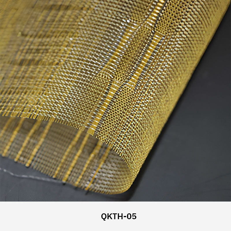 FibraMetis QKTH architectural mesh drapery used as interior wall cladding, featuring custom woven metal fabric with elegant metallic finishes.