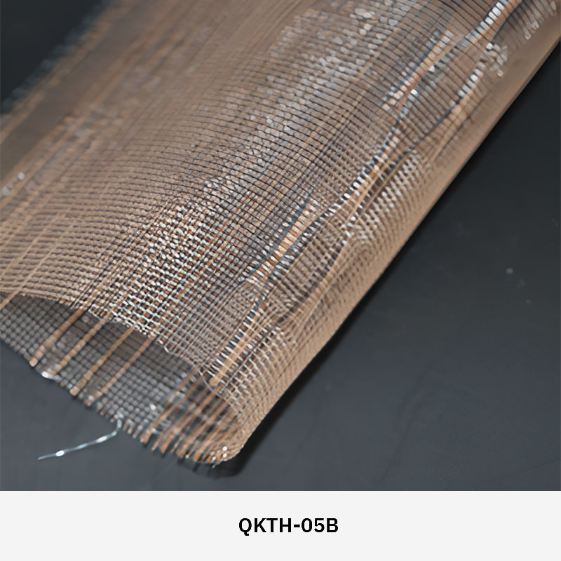 FibraMetis QKTH architectural mesh drapery used as interior wall cladding, featuring custom woven metal fabric with elegant metallic finishes.