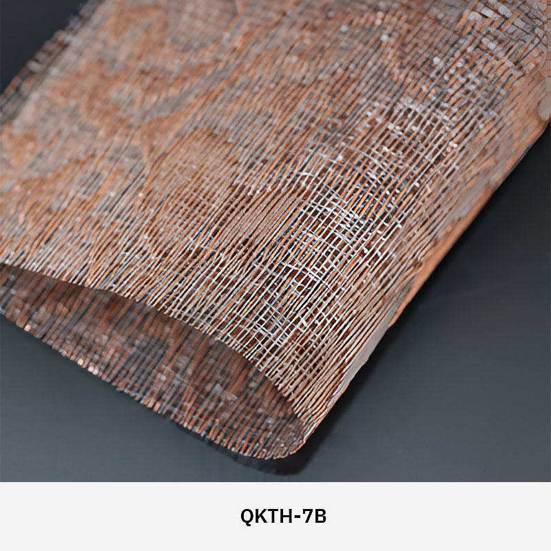 FibraMetis QKTH architectural mesh drapery used as interior wall cladding, featuring custom woven metal fabric with elegant metallic finishes.