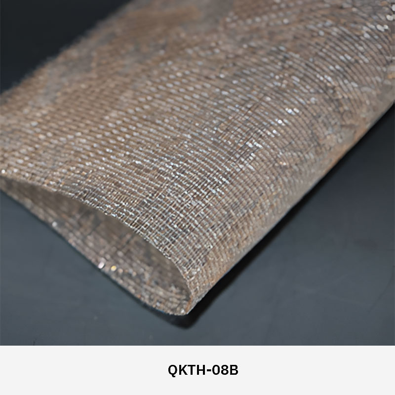 FibraMetis QKTH architectural mesh drapery used as interior wall cladding, featuring custom woven metal fabric with elegant metallic finishes.