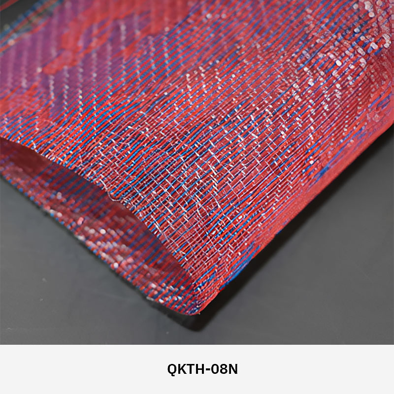 FibraMetis QKTH architectural mesh drapery used as interior wall cladding, featuring custom woven metal fabric with elegant metallic finishes.