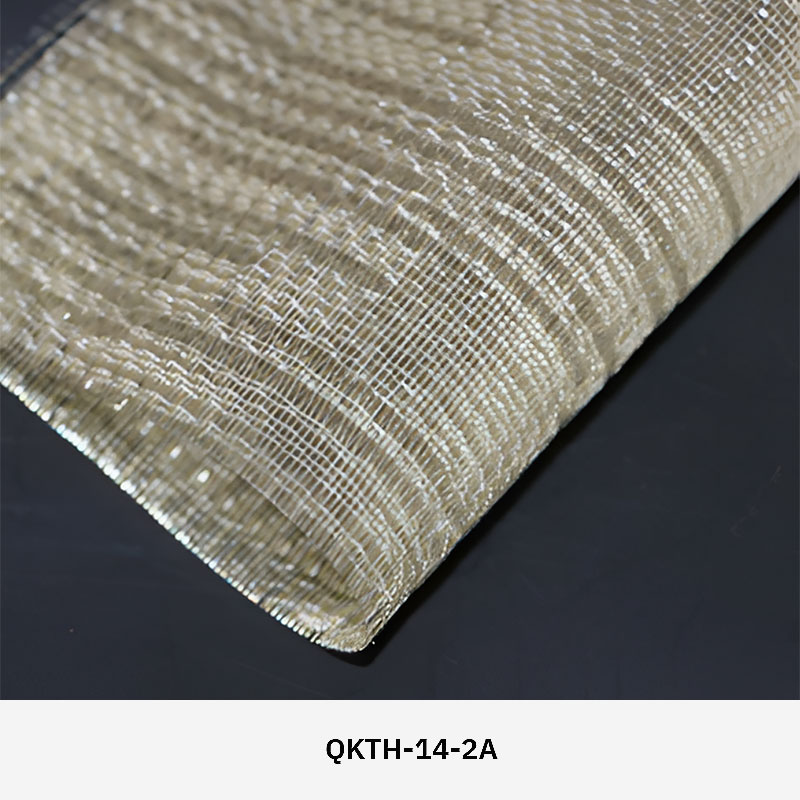 FibraMetis QKTH architectural mesh drapery used as interior wall cladding, featuring custom woven metal fabric with elegant metallic finishes.