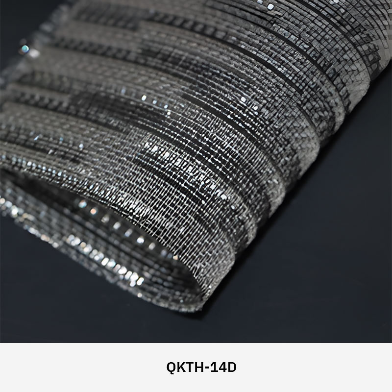 FibraMetis QKTH architectural mesh drapery used as interior wall cladding, featuring custom woven metal fabric with elegant metallic finishes.