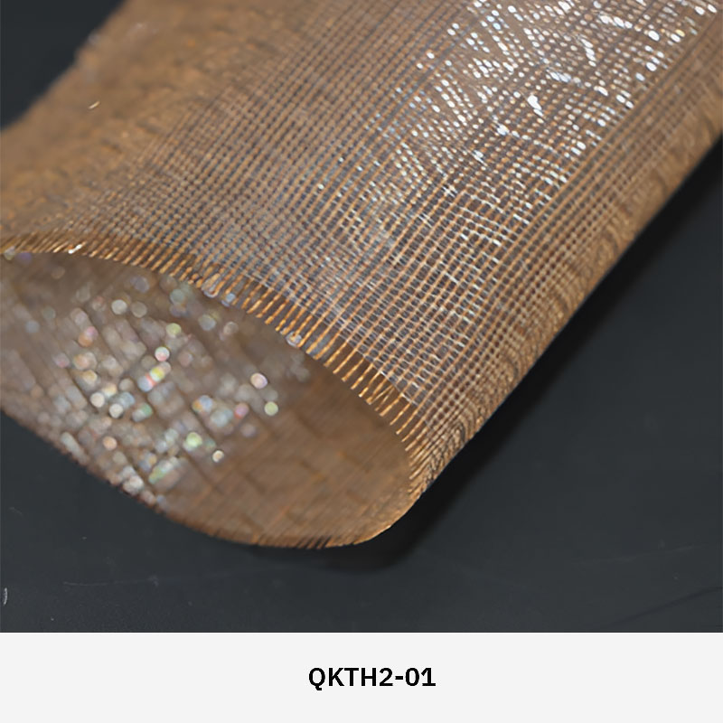 FibraMetis QKTH2 decorative wire textile applied on interior wall panels, featuring custom woven metal mesh with refined metallic finishes.