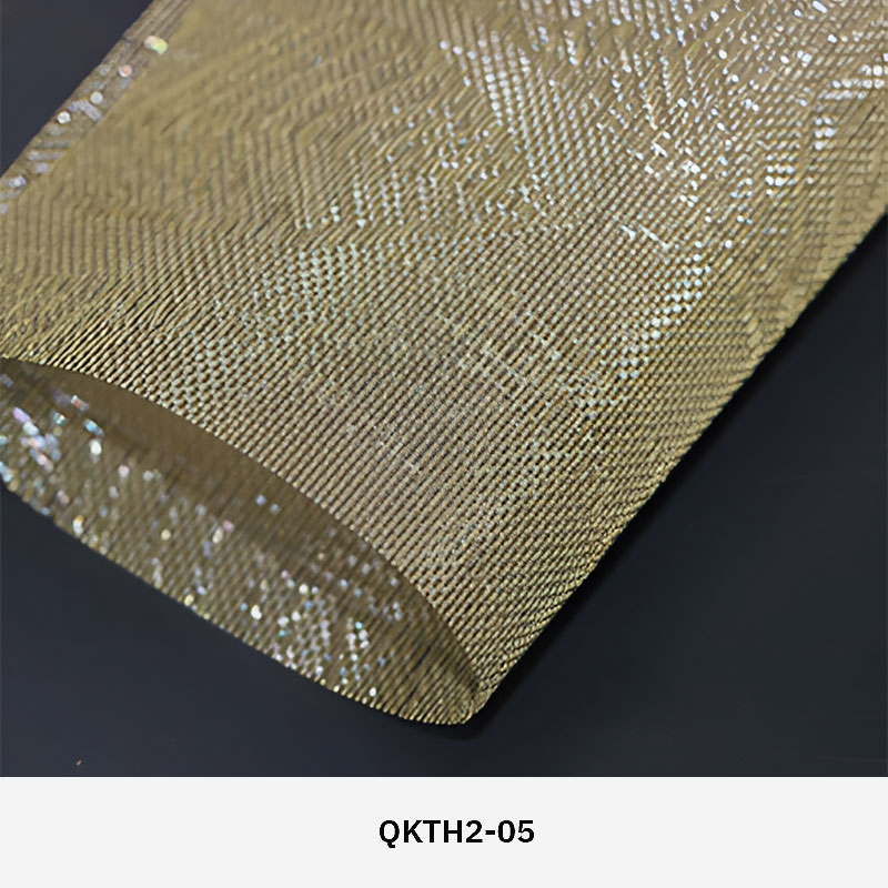 FibraMetis QKTH2 decorative wire textile applied on interior wall panels, featuring custom woven metal mesh with refined metallic finishes.