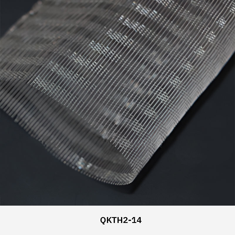 FibraMetis QKTH2 decorative wire textile applied on interior wall panels, featuring custom woven metal mesh with refined metallic finishes.