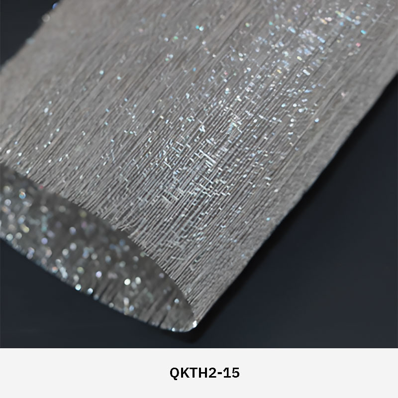 FibraMetis QKTH2 decorative wire textile applied on interior wall panels, featuring custom woven metal mesh with refined metallic finishes.
