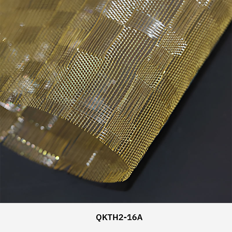 FibraMetis QKTH2 decorative wire textile applied on interior wall panels, featuring custom woven metal mesh with refined metallic finishes.