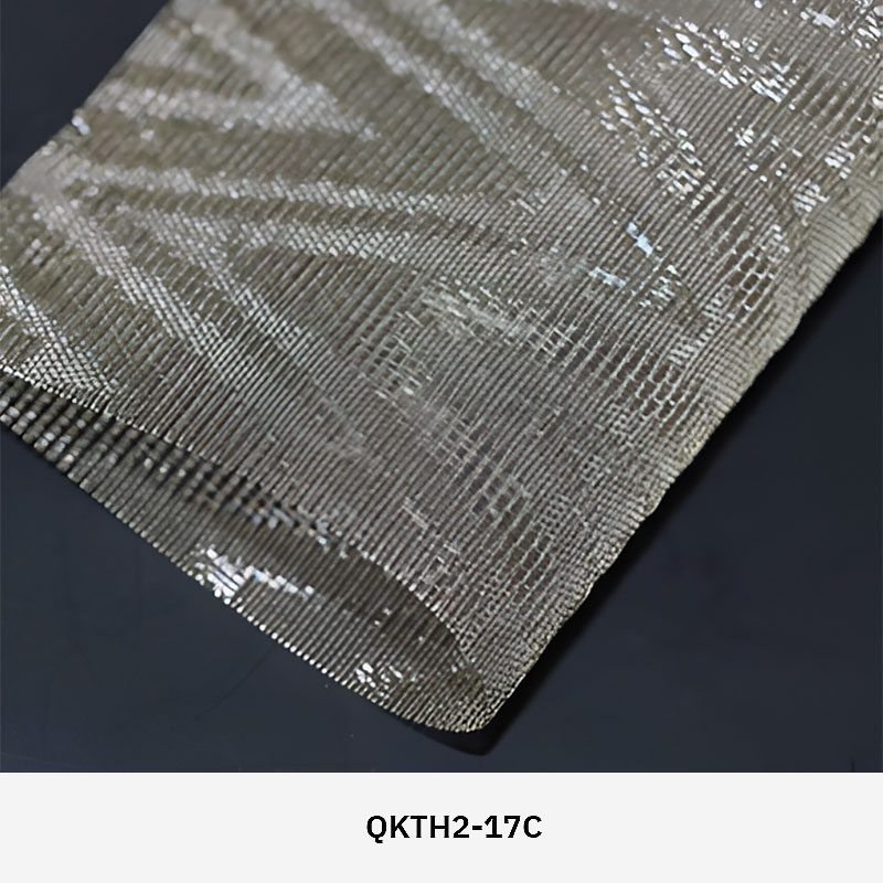 FibraMetis QKTH2 decorative wire textile applied on interior wall panels, featuring custom woven metal mesh with refined metallic finishes.