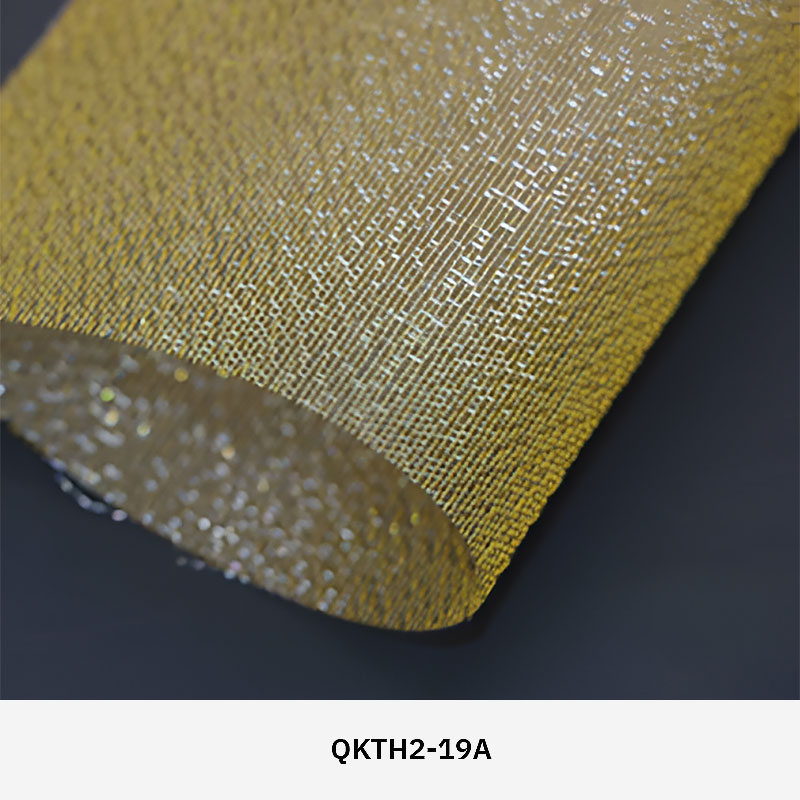 FibraMetis QKTH2 decorative wire textile applied on interior wall panels, featuring custom woven metal mesh with refined metallic finishes.