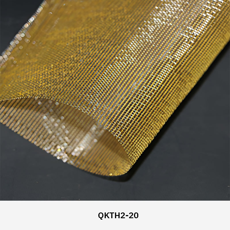 FibraMetis QKTH2 decorative wire textile applied on interior wall panels, featuring custom woven metal mesh with refined metallic finishes.