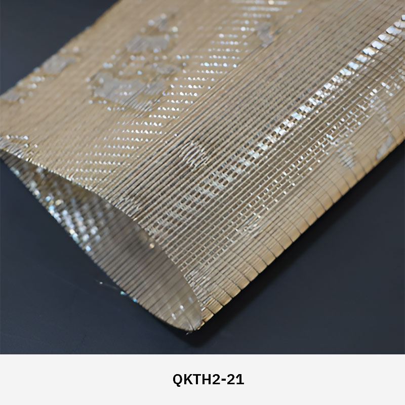 FibraMetis QKTH2 decorative wire textile applied on interior wall panels, featuring custom woven metal mesh with refined metallic finishes.