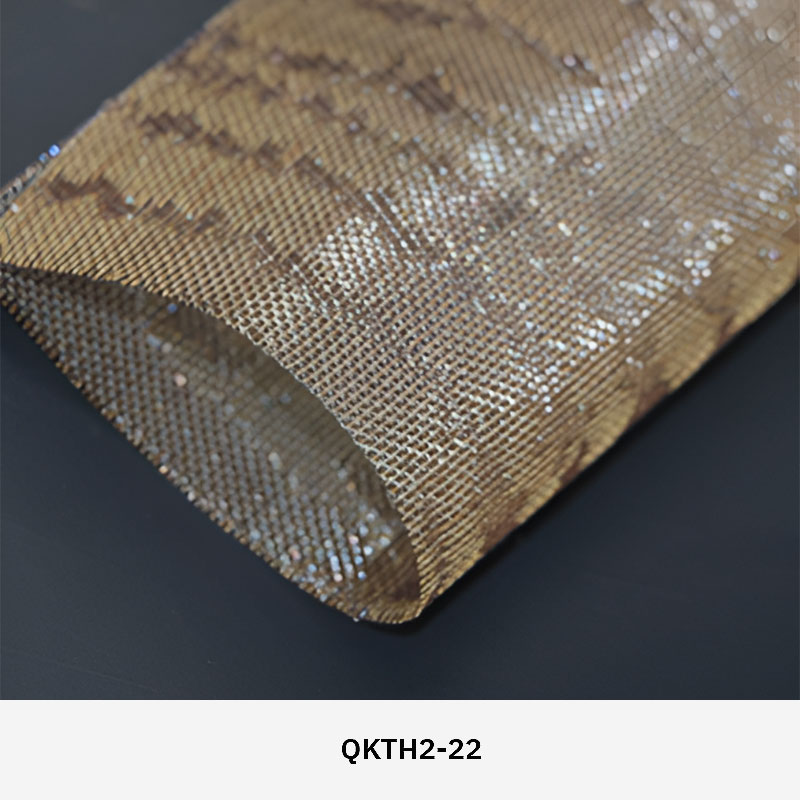 FibraMetis QKTH2 decorative wire textile applied on interior wall panels, featuring custom woven metal mesh with refined metallic finishes.