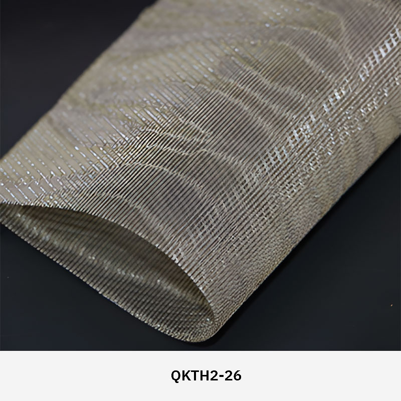 FibraMetis QKTH2 decorative wire textile applied on interior wall panels, featuring custom woven metal mesh with refined metallic finishes.