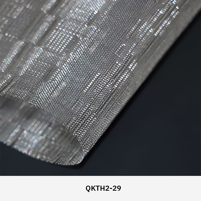 FibraMetis QKTH2 decorative wire textile applied on interior wall panels, featuring custom woven metal mesh with refined metallic finishes.