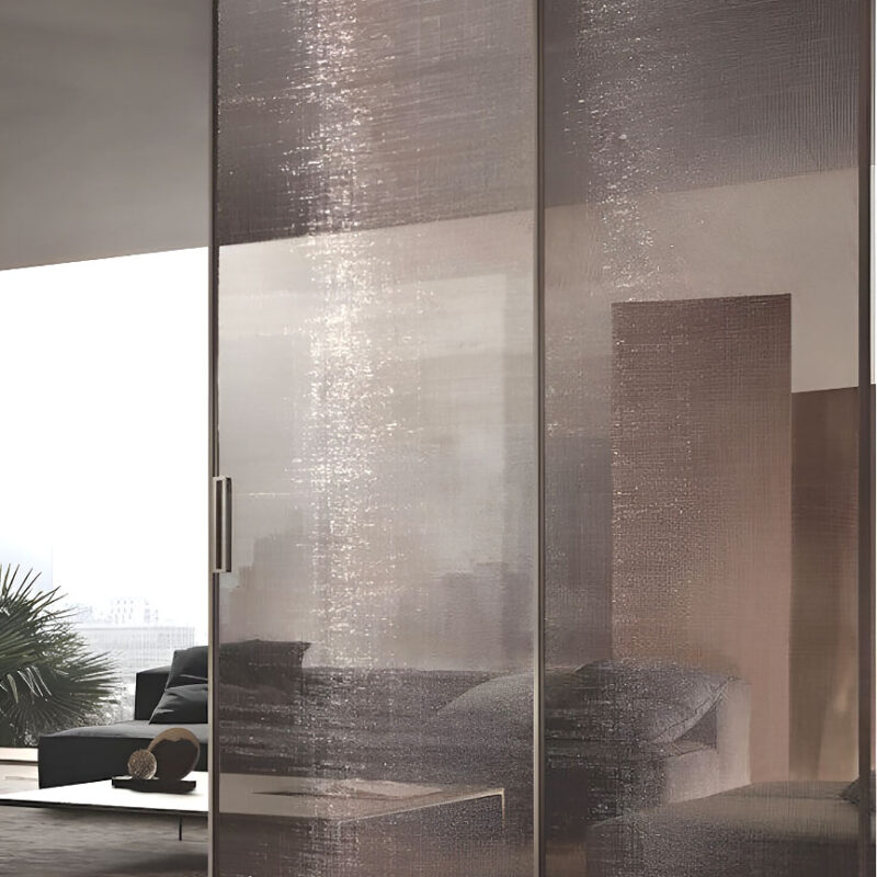 GlasMetis laminated wire mesh glass with metallic mesh layer, shown in custom finish for modern architectural use