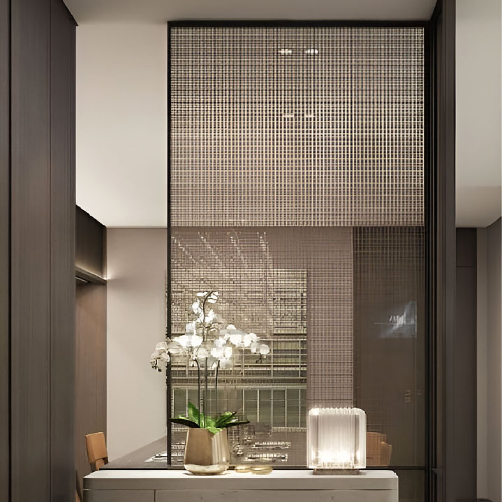 GlasMetis laminated wire mesh glass with metallic mesh layer, shown in custom finish for modern architectural use