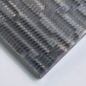 GlasMetis QKGTH laminated wire mesh glass with metallic mesh layer, shown in custom finish for modern architectural use