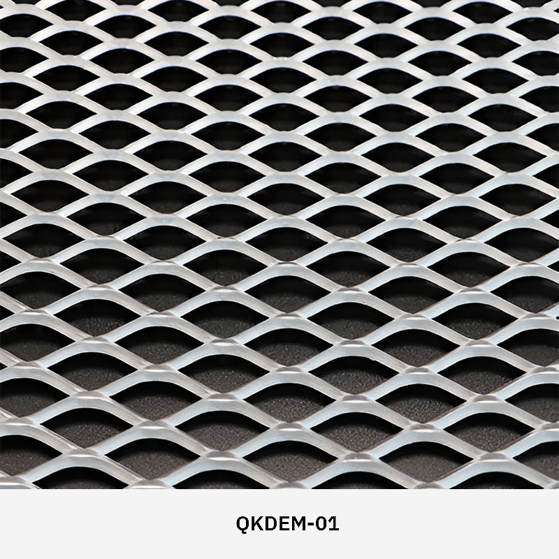 Expanded metal mesh panel with diamond-shaped openings used as architectural partition and facade feature.