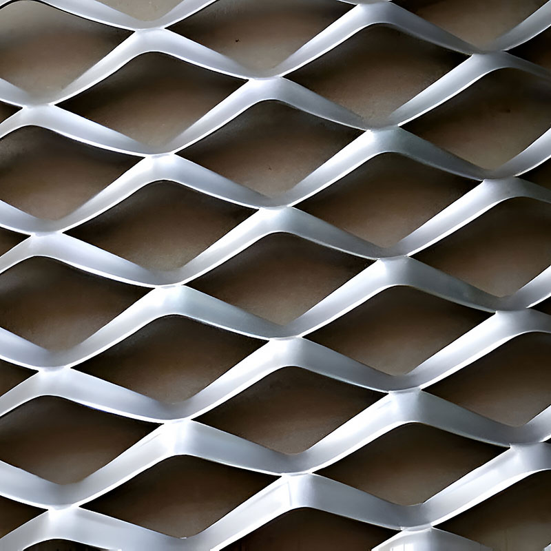Expanded metal mesh panel with diamond-shaped openings used as architectural partition and facade feature.