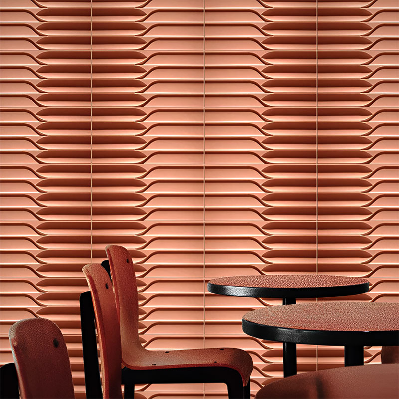 Modern 3D wall tile made from ultra-high performance concrete with sculptural grooves, ideal for feature walls in residential and commercial interiors.