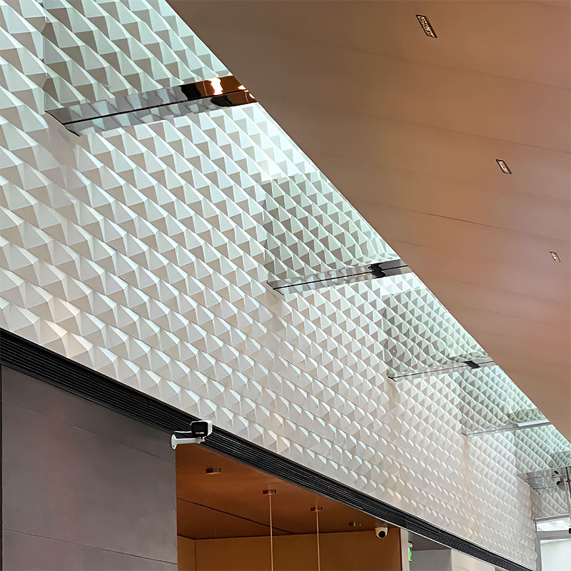 Geometric 3D wall tile with triangular pattern in matte and metallic finish, ideal for residential and commercial interior feature walls.