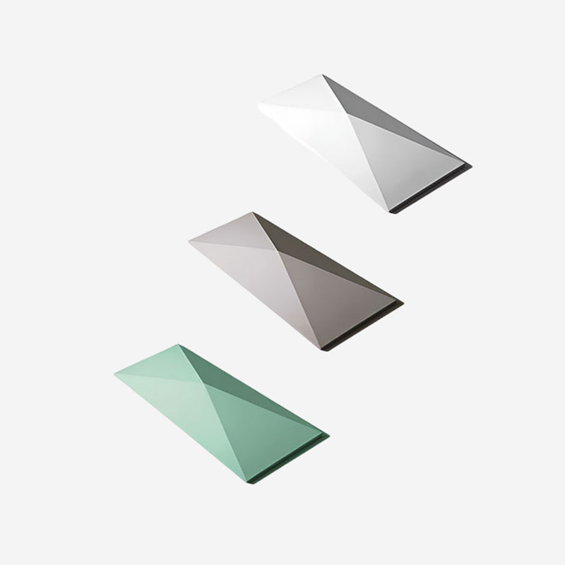 Geometric 3D wall tile with triangular pattern in matte and metallic finish, ideal for residential and commercial interior feature walls.