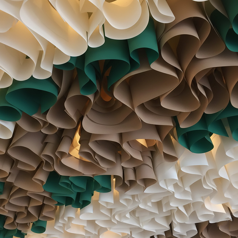 Colorful modern paper ceiling design by TEXTURA CMPC featuring eco-friendly DuPont paper and vibrant ceiling textures.