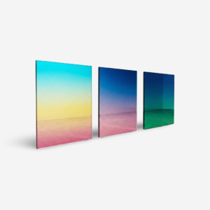 Custom gradient decorative glass panel with smooth surface and shifting color effect installed on a modern interior wall
